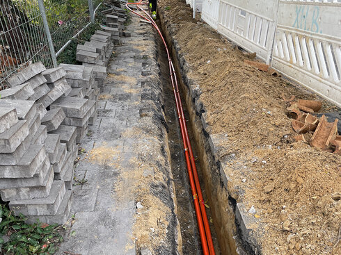 Construction site where a fiber optic cable is being laid
